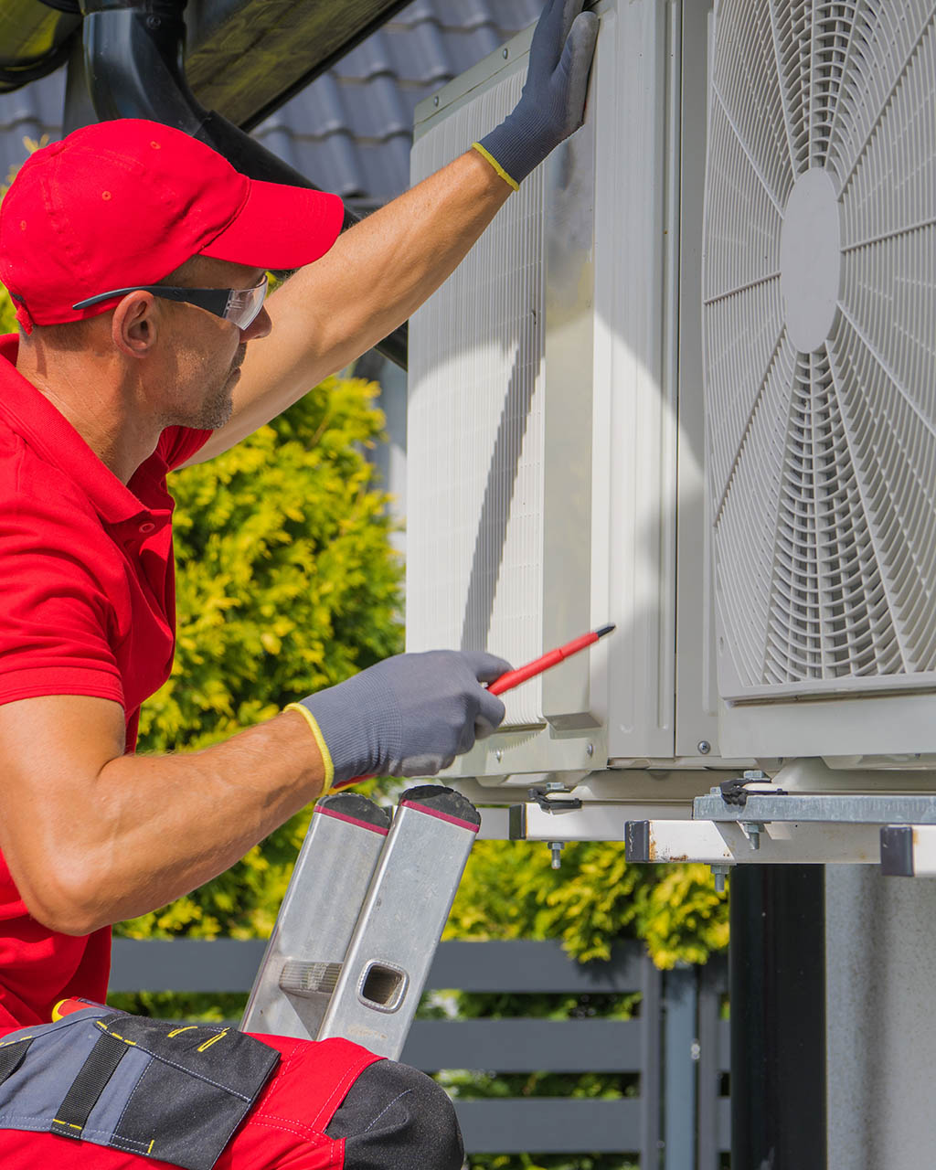 HVAC technician servicing a residential air-conditioning system